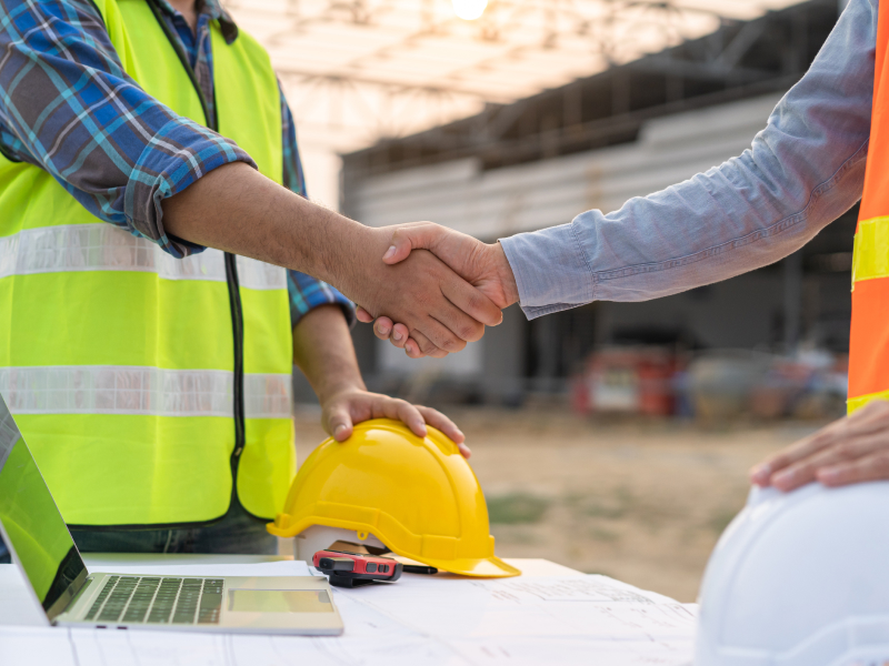 2 Building Construction Worker shaking hands 